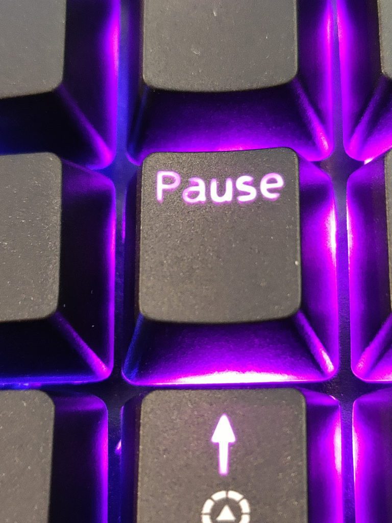 Picture of key caps showing uneven shine-through lighting.